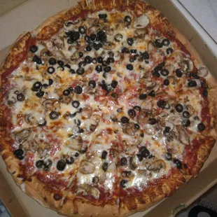 Large pizza with blk olives and mushrooms