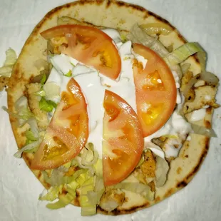 tomatoes and lettuce on a tortilla
