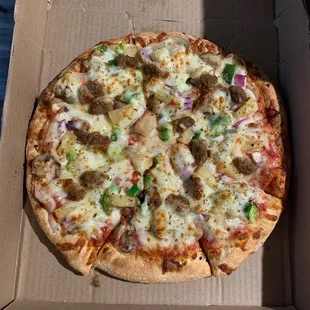 a pizza in a cardboard box