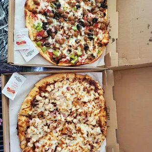 two pizzas in boxes