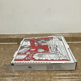 a pizza box on a counter top