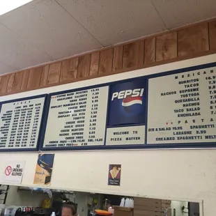 menus on the wall of a restaurant
