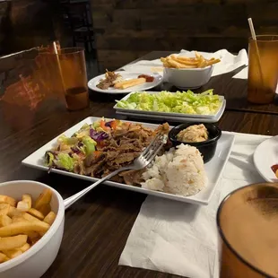 Combo gyro plate and bowls of French fries