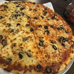 Half Garlic Cheese Pizza with pepperoni olives and pineapple