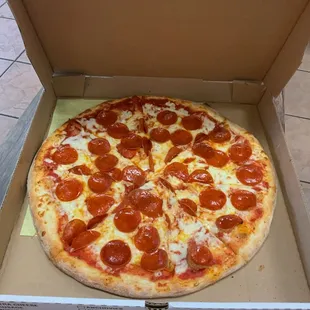 a pepperoni pizza in a box