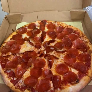 a pepperoni pizza in a box
