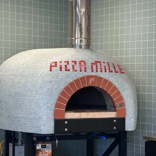 Pizza oven not sure if it's wood fire but looks cool.