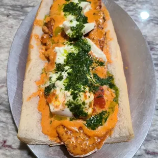 a piece of bread with cheese and spinach