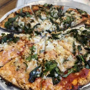 10&quot; Basic Gluten Free Pizza with spinach and garlic with dairy free cheese on a 10&quot; pizza