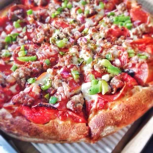 Pepperoni, sausage, onions, and green peppers! Sooooo good! Very fresh.