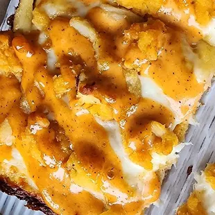 a slice of pizza with cheese and sauce