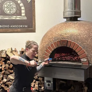 Maria working the pizza....