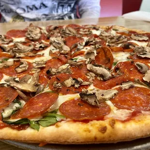 Pepperoni, spinach and mushroom pizza. Delish!