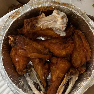 chicken wings in a foil container