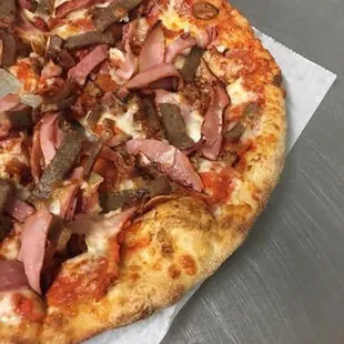 Meat lovers pizza .