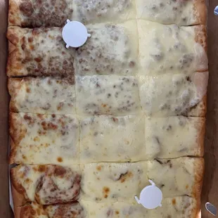 Large pepperoni , sausage, double cheese pizza.