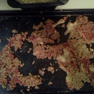 This is the toppings off of two pieces of pizza!! Theres enough here for 2 more whole pizzas!!! YUCK!!!