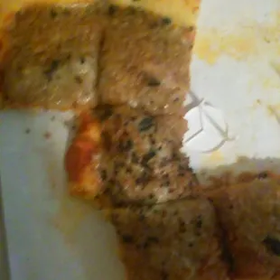 a half eaten pizza in a box