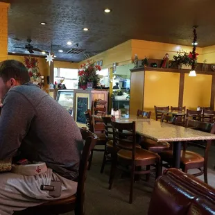 a man sitting at a table in a restaurant