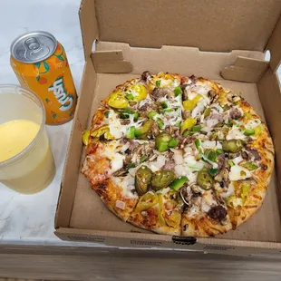 a box of pizza and a drink