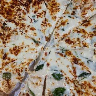 a cheese pizza cut into eight slices