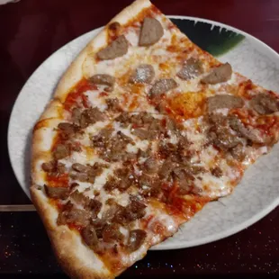 Lunch special 2 slices with meatballs and sausage.