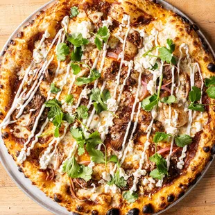 a close up of a pizza with toppings