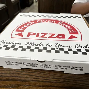 a box of pizza sitting on a table