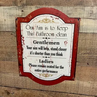a sign on a wooden wall