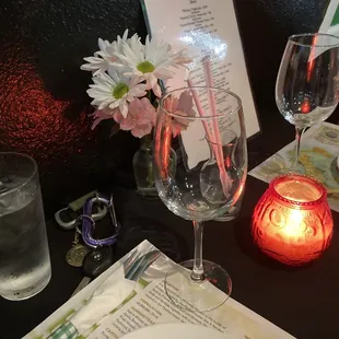 a glass of water and flowers