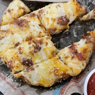 Cheesy QuesoStix with bacon. Cheddar and mozzarella mix