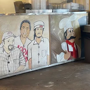 a mural of a chef and his family