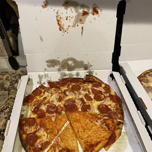 Pizza that may have been dropped was also missing one of the toppings we ordered.