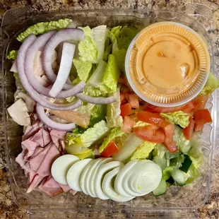 a salad in a plastic container