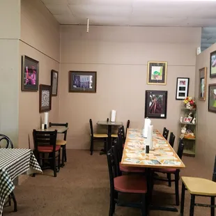 a dining room with tables and chairs
