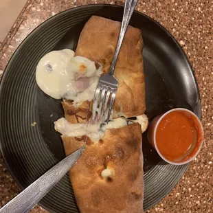 Stromboli with ham, black olives, and extra cheese. The sauce was perfect!