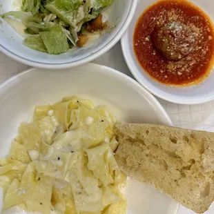 $8 daily pasta special: fettuccine alfredo and Caesar salad. Added a meatball.