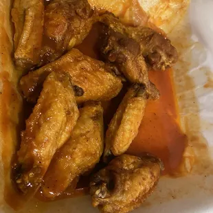 Wings, not crispy, swimming in sauce