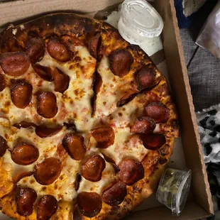 a pepperoni pizza in a box