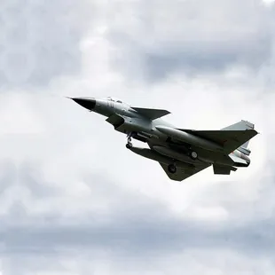 a fighter jet flying in the sky