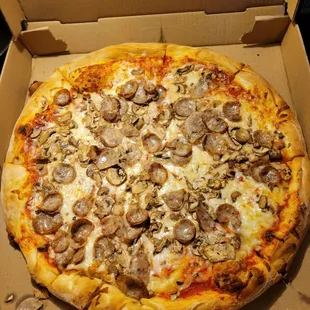 a pizza in a cardboard box