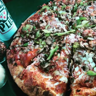 a whole pizza and a soda