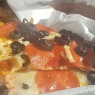 a slice of pizza in a box