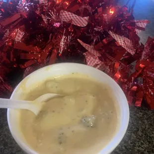 a bowl of soup with a spoon in it