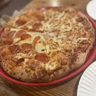 Medium half pepperoni half cheese pizza with extra cheese