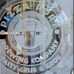 a glass window with a logo on it