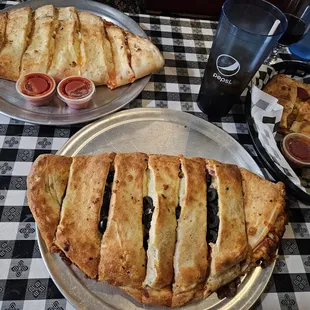 two plates of food on a checkered tablecloth