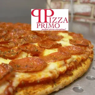 a pepperoni pizza on a pizza pan