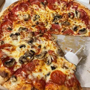 Pepperoni and mushrooms.  Fresh mushrooms preferred over canned mushrooms.