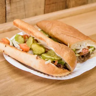 a sandwich on a paper plate